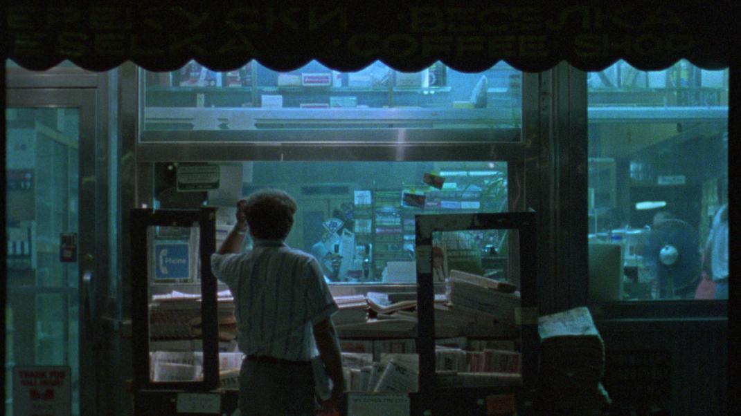 A man looks through a store display in Chantal Akerman's News From Home