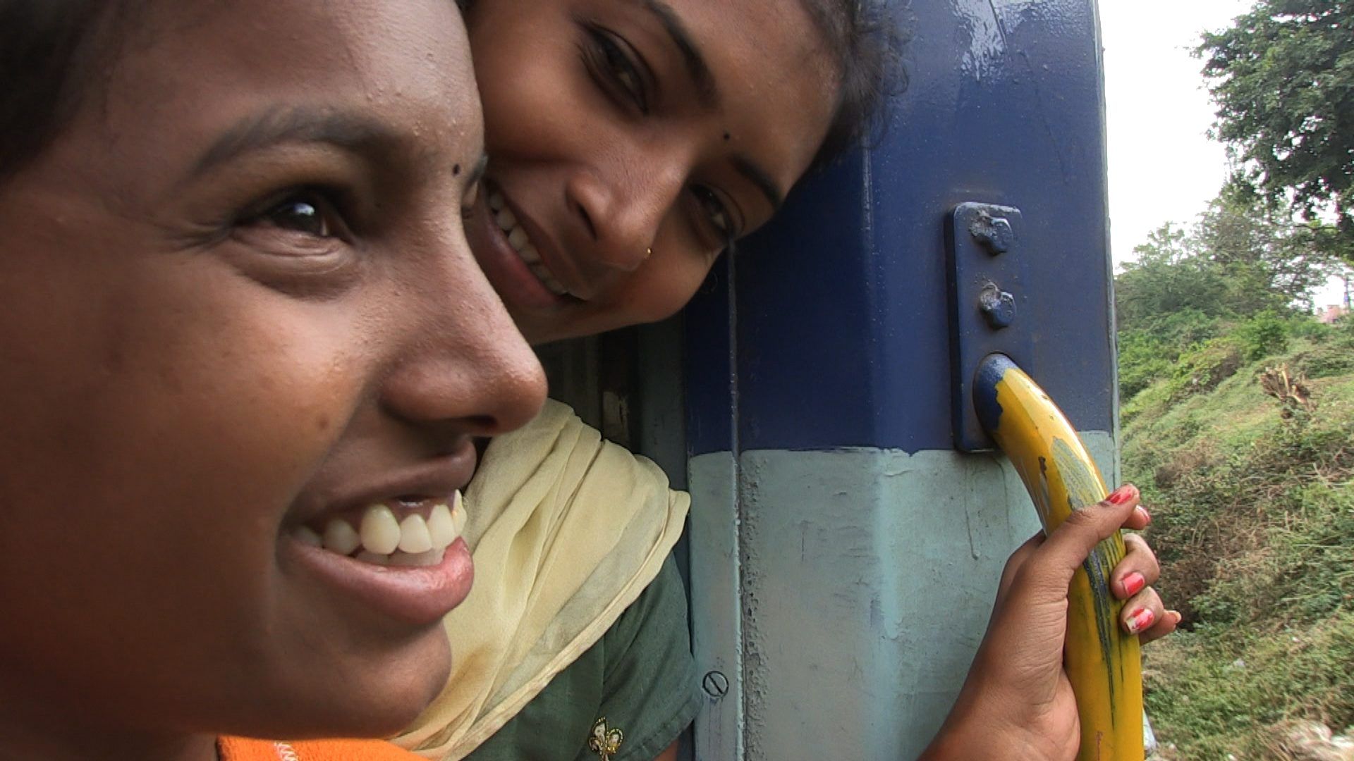 Two young girls from rural India on a train