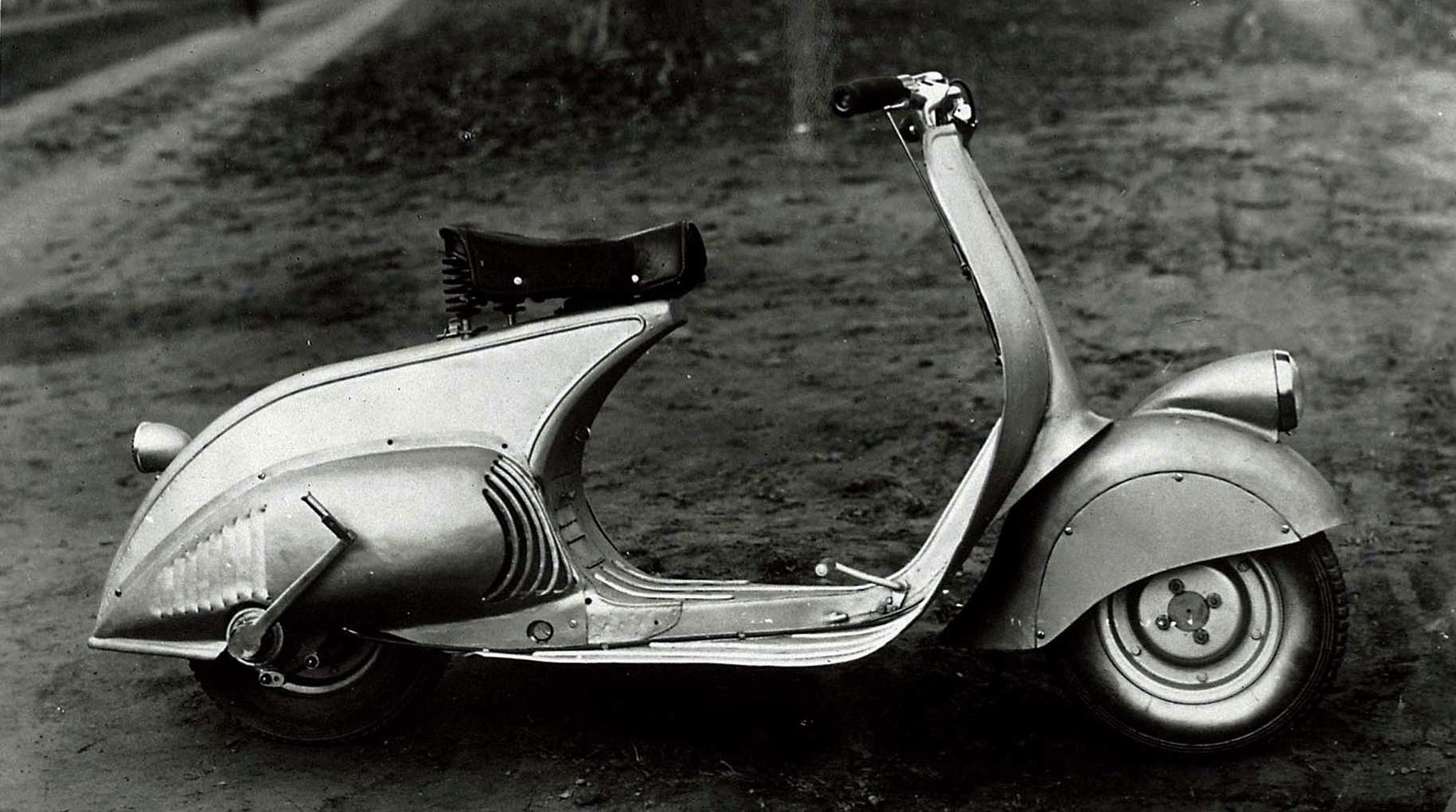 A black and white picture of the vespa motor bike