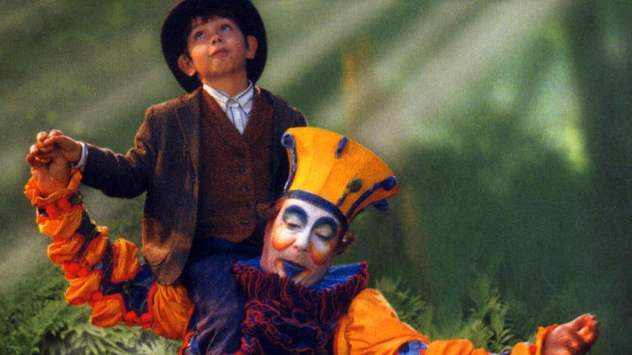 Two Cirque de Soleil characters in a garden set