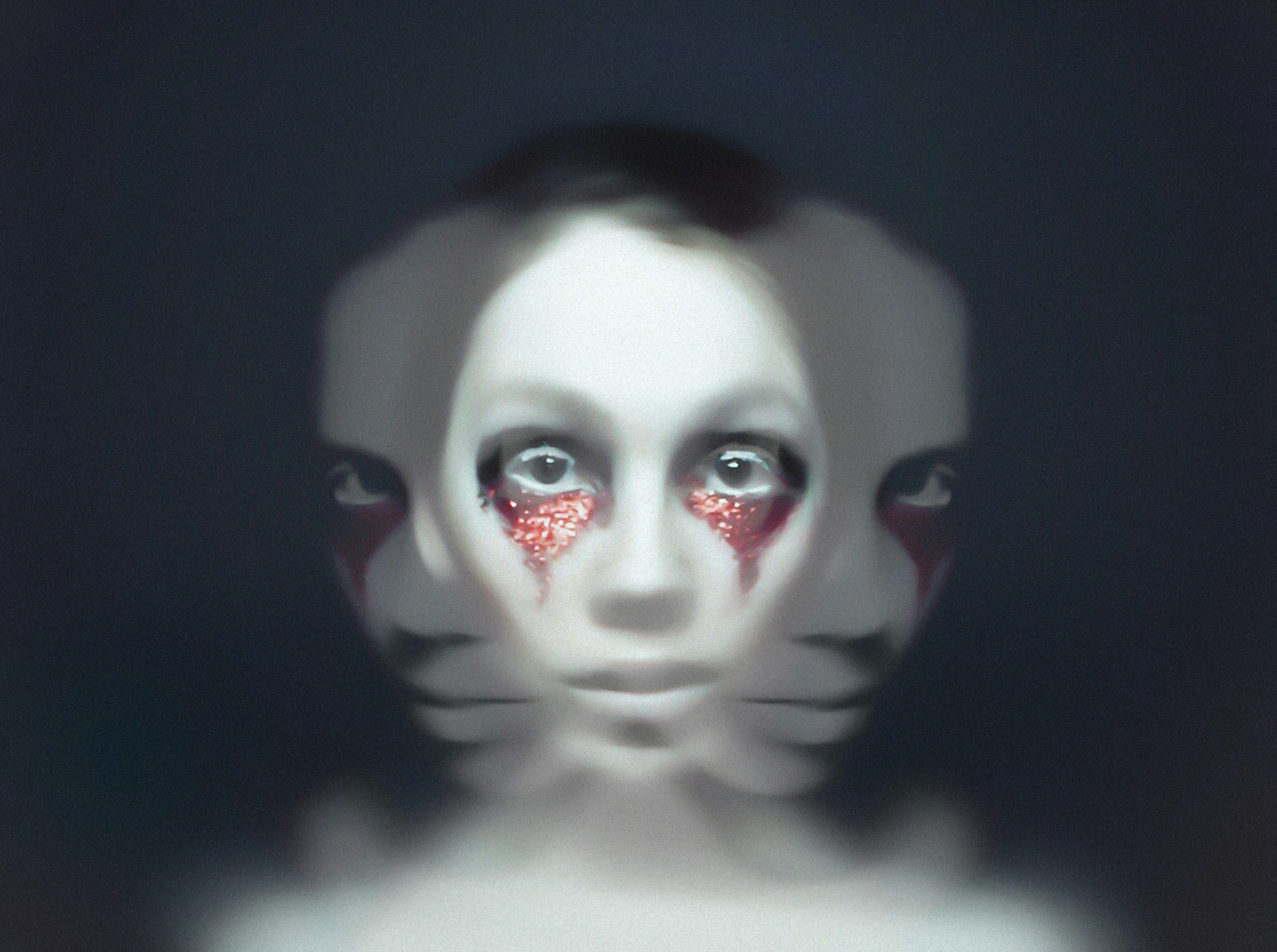 An ominous portrait of a girl wearing red makeup