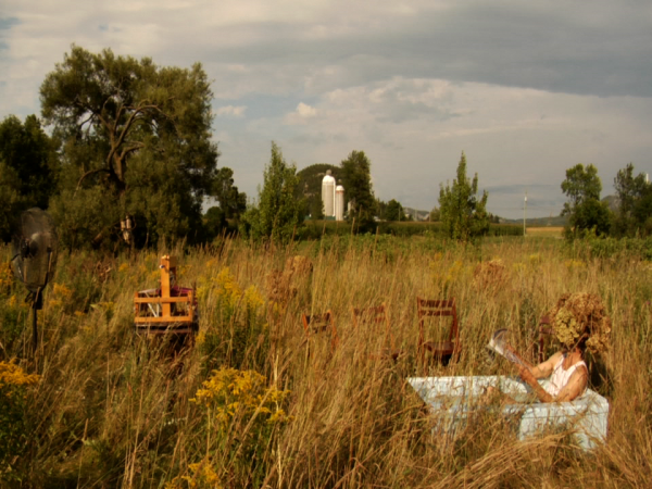  Surreal landscape with a bush headed man