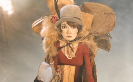 a doll of a person in a brown outfit