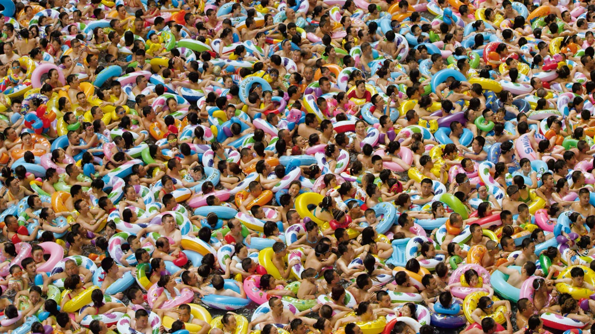 a large crowd of people with floats