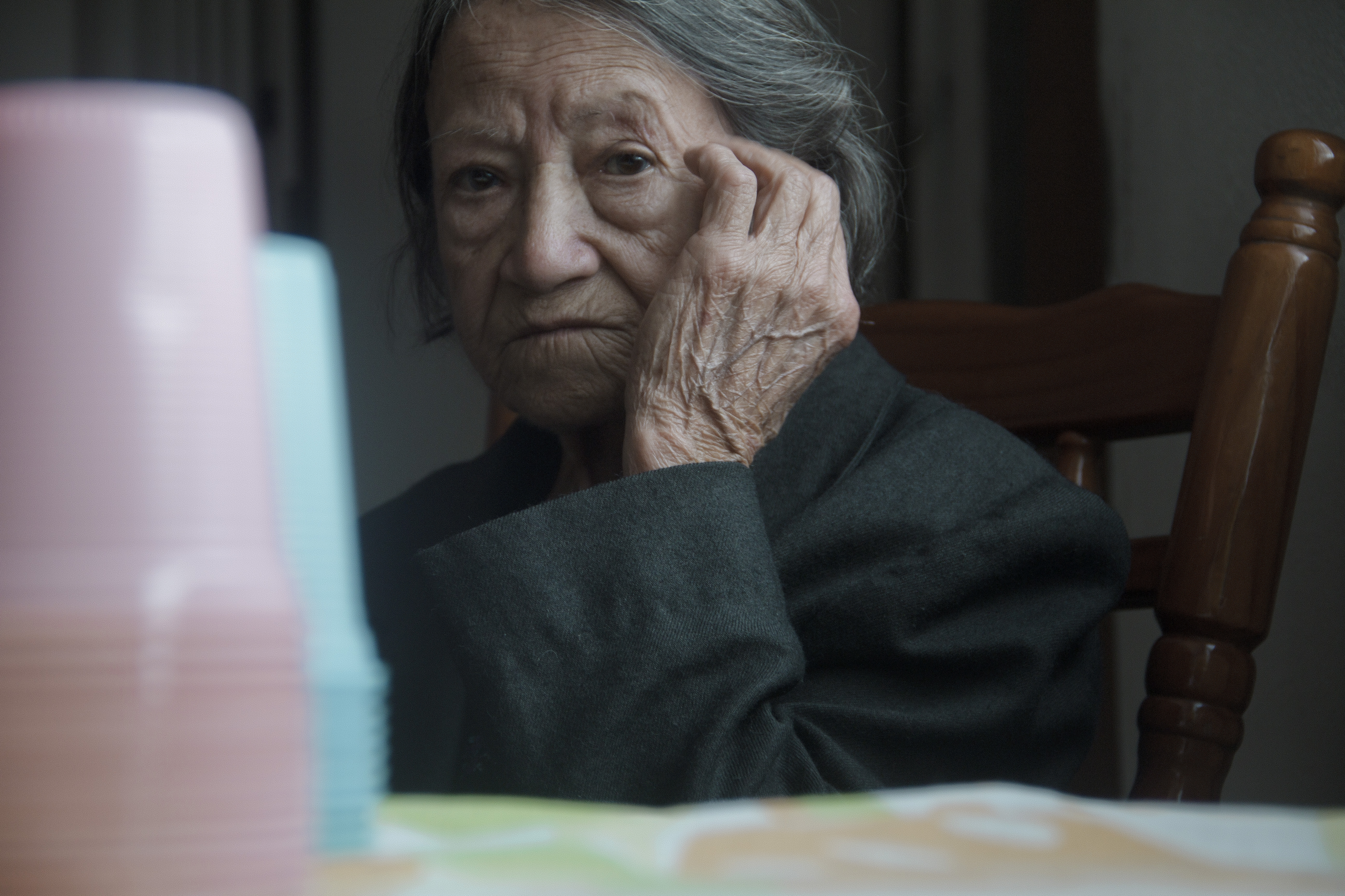 a gray-haired woman with a peaceful look