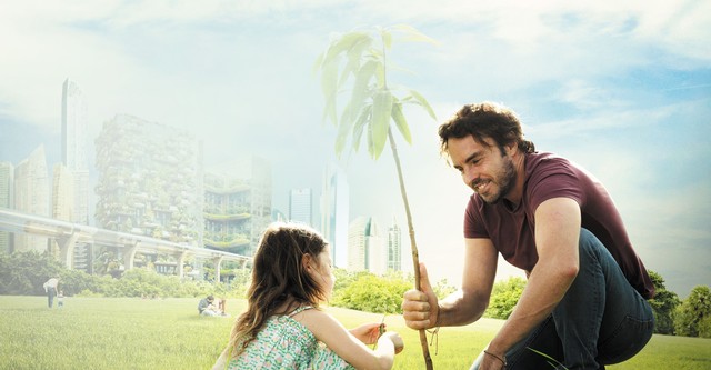 Father and daughter plant a tree