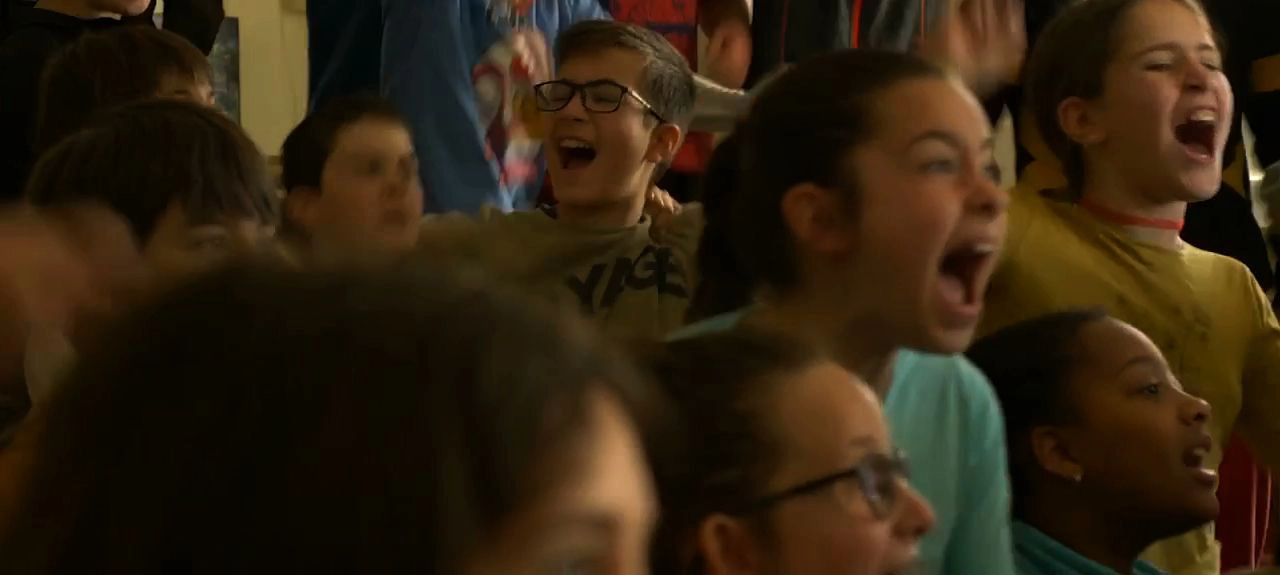 a group of angry children scream