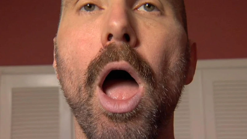 bearded man close-up open mouth