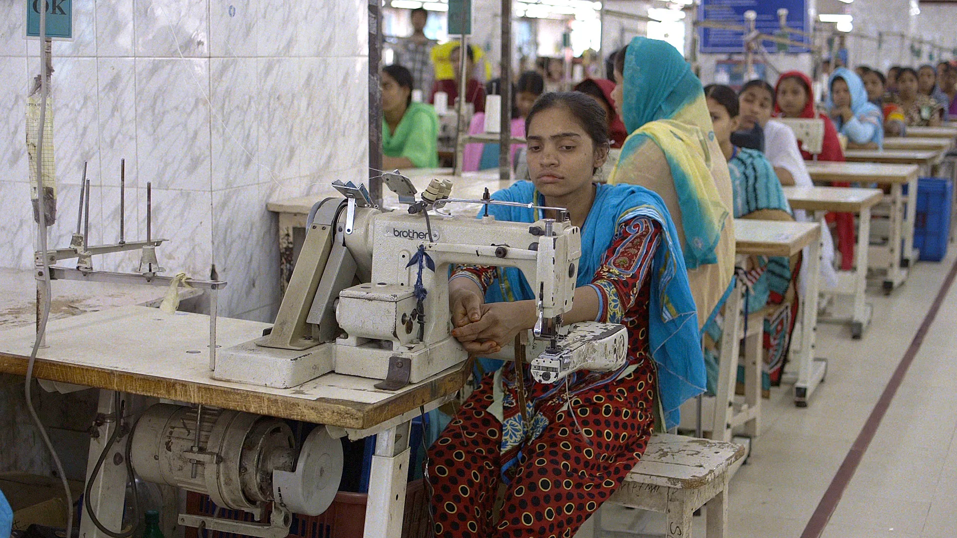 a woman behind a sewing machine
