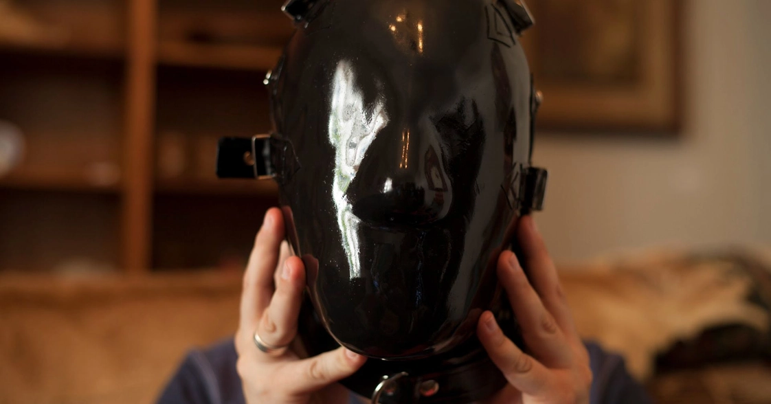 a man with a black vinyl mask