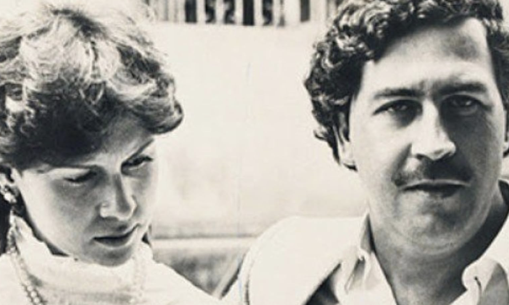 woman with short hair and man with dark hair and a mustache