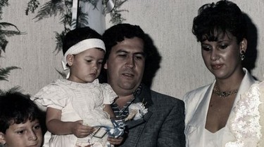 boy, girl with white headband and dress, man in suit and tie, woman in wedding dress