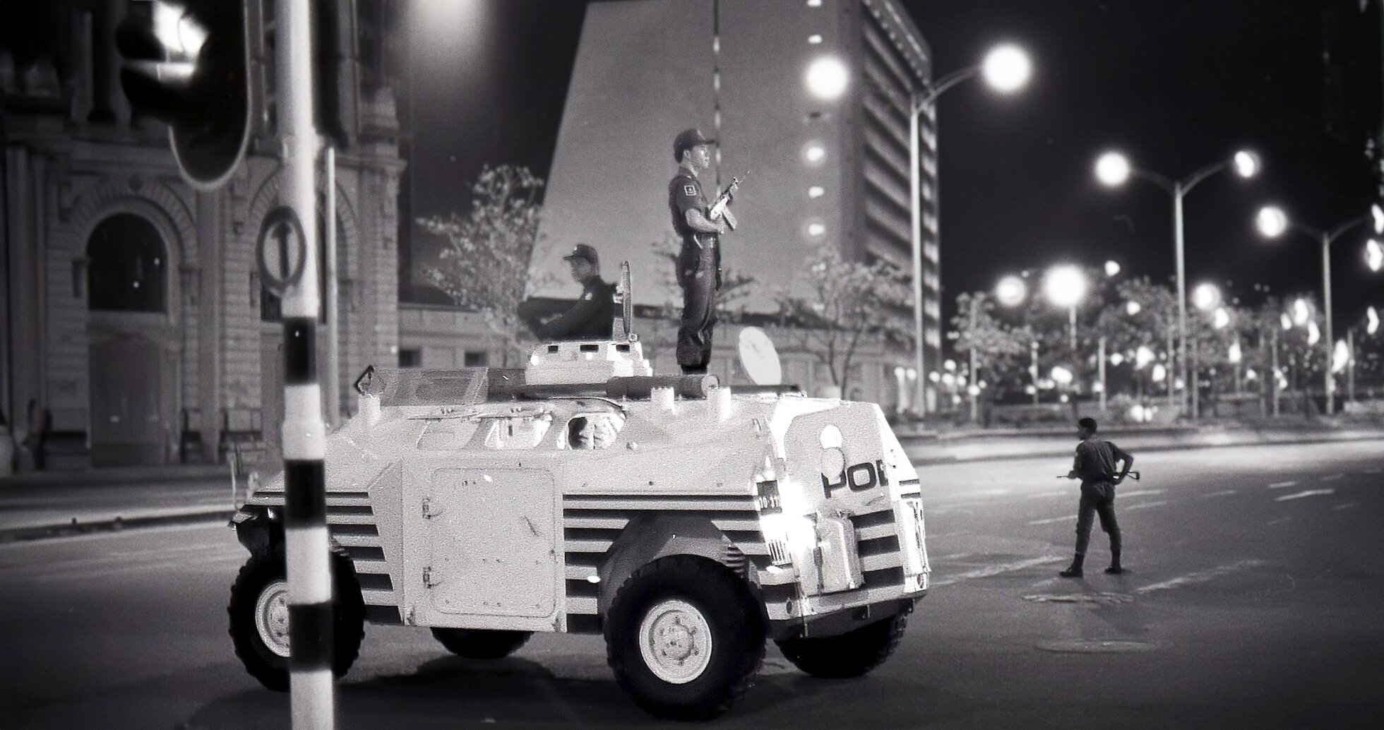 an armored vehicle and an officer on top