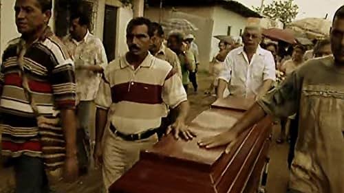 group of men carrying a wooden coffin.