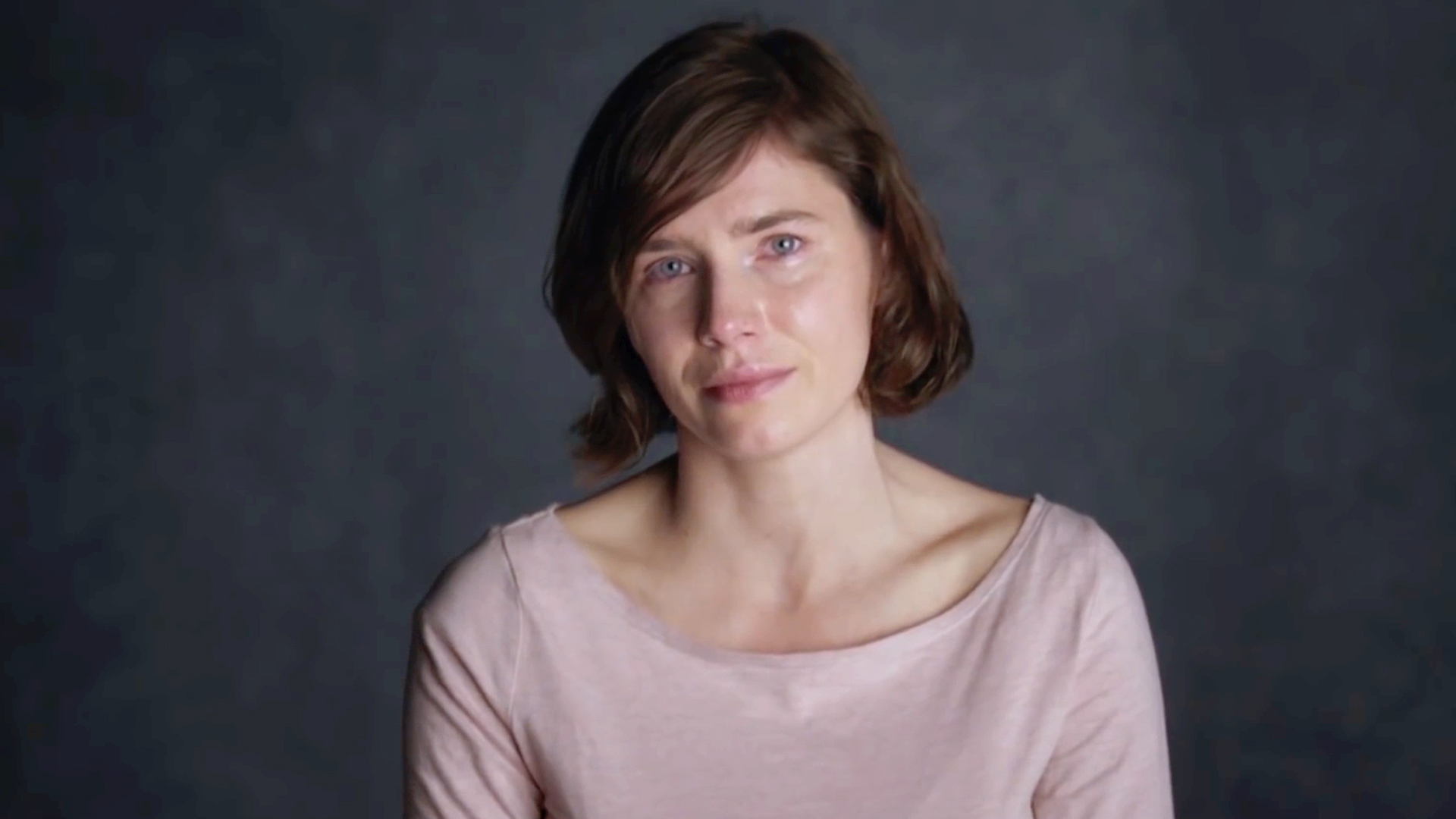 dark-haired girl in front of camera